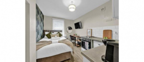 Green Reverie: Stylish Studio Escape